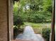 Charming home entryway with stone walkway and lush, green landscaping at 3600 Trail 23 St, Durham, NC 27707