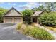 Charming brick home featuring a two-car garage, manicured landscaping, and a welcoming front entrance at 3600 Trail 23 St, Durham, NC 27707