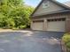 Exterior view of the two car garage with a brick exterior at 3600 Trail 23 St, Durham, NC 27707