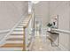 Inviting foyer with marble floors, staircase, chandelier, and elegant décor, creating a grand entrance at 3600 Trail 23 St, Durham, NC 27707