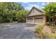 Well-maintained garage with ample parking space, surrounded by lush greenery at 3600 Trail 23 St, Durham, NC 27707