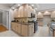 Well-lit kitchen with custom wood cabinets, granite countertops, and black stainless steel oven and microwave at 3600 Trail 23 St, Durham, NC 27707