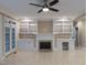 Spacious living room with a fireplace, built-in shelving, and access to the outside at 3600 Trail 23 St, Durham, NC 27707