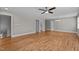 Expansive living room with hardwood floors, multiple doors, and recessed lighting at 3600 Trail 23 St, Durham, NC 27707