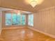 Elegant living room with hardwood floors, large windows, and chandelier at 3600 Trail 23 St, Durham, NC 27707
