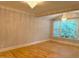 Spacious room with hardwood floors, elegant chandeliers, and ample natural light at 3600 Trail 23 St, Durham, NC 27707