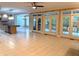 Spacious living room features a center island kitchen, many windows, and access to a covered porch at 3600 Trail 23 St, Durham, NC 27707