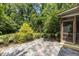 View of the backyard patio and screened porch with access to the beautiful, secluded yard at 3600 Trail 23 St, Durham, NC 27707