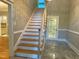 Open staircase with wood treads and white risers leading to the upper level at 3600 Trail 23 St, Durham, NC 27707