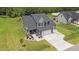 Gorgeous two-story home with well-maintained lawn, double garage, and cozy front porch area at 385 Jackson Pond Dr, Smithfield, NC 27577
