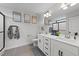 Modern bathroom with double sink vanity, sleek mirrors, and a glass-enclosed shower at 385 Jackson Pond Dr, Smithfield, NC 27577