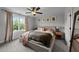 Comfortable bedroom featuring a ceiling fan, neutral walls, and carpeted floors at 385 Jackson Pond Dr, Smithfield, NC 27577
