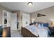 Neutral bedroom with a comfortable bed, side tables, and double door closet at 385 Jackson Pond Dr, Smithfield, NC 27577