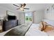 Bedroom featuring a comfortable bed, dresser, and window with a view of the backyard at 385 Jackson Pond Dr, Smithfield, NC 27577