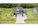 Beautiful two-story home with landscaped front yard and a long driveway leading to a two-car garage at 385 Jackson Pond Dr, Smithfield, NC 27577