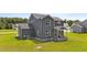 Aerial view of the home's backyard with a covered porch and lawn at 385 Jackson Pond Dr, Smithfield, NC 27577