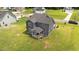 Aerial view of the home's backyard with a covered porch and large lawn at 385 Jackson Pond Dr, Smithfield, NC 27577