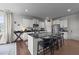 Modern kitchen featuring white cabinets, black granite countertops, and stainless steel appliances at 385 Jackson Pond Dr, Smithfield, NC 27577