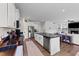 Spacious kitchen featuring an island and views into the living room at 385 Jackson Pond Dr, Smithfield, NC 27577