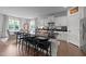 Modern kitchen with black countertops, white cabinets, and stainless steel appliances at 385 Jackson Pond Dr, Smithfield, NC 27577