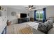 Inviting living room with a large window, ceiling fan, and patterned area rug at 385 Jackson Pond Dr, Smithfield, NC 27577