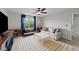 Inviting living room with a large window, ceiling fan, and patterned area rug at 385 Jackson Pond Dr, Smithfield, NC 27577