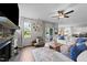 Bright living room with fireplace, ceiling fan, and sliding glass doors to the backyard at 385 Jackson Pond Dr, Smithfield, NC 27577