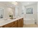 Bathroom boasts a soaking tub, walk-in shower and vanity offering a spa-like experience at 400 Indian Elm Ln, Cary, NC 27519
