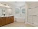 Bathroom boasts a soaking tub, walk-in shower and vanity offering a spa-like experience at 400 Indian Elm Ln, Cary, NC 27519