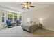 Bedroom with natural light, accent chairs, and neutral decor at 400 Indian Elm Ln, Cary, NC 27519