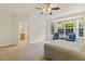Bedroom with accent chairs and bright view from bay windows at 400 Indian Elm Ln, Cary, NC 27519