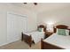 Bedroom featuring two twin beds and a closet offering a comfortable and welcoming space at 400 Indian Elm Ln, Cary, NC 27519