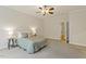 A well-lit bedroom features a ceiling fan and soft decor creating a calm, inviting space at 400 Indian Elm Ln, Cary, NC 27519