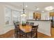 Sunny dining area with bay window and wood table with seating for six people at 400 Indian Elm Ln, Cary, NC 27519