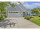 Charming home featuring a two-car garage, beautiful landscaping and a well-maintained driveway at 400 Indian Elm Ln, Cary, NC 27519