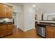 The kitchen displays wood cabinets, stainless steel appliances, and a practical layout with an adjacent dining area at 400 Indian Elm Ln, Cary, NC 27519
