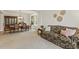 Combined living and dining area with elegant furniture, a bay window, and a seamless flow for entertaining at 400 Indian Elm Ln, Cary, NC 27519