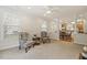 Bright open-concept living room with hardwood floors and view to the kitchen at 400 Indian Elm Ln, Cary, NC 27519
