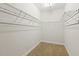 Spacious walk-in closet with ample shelving and storage solutions, perfect for organization at 400 Indian Elm Ln, Cary, NC 27519