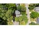 Aerial shot showcasing a home with mature trees in a well-maintained neighborhood at 405 Widdington Ln, Cary, NC 27519
