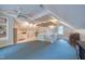 Finished attic with sloped ceilings, kitchenette, storage, and carpeted floor at 405 Widdington Ln, Cary, NC 27519