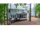 Charming home featuring a screened porch, deck, and well-maintained exterior in a serene setting at 405 Widdington Ln, Cary, NC 27519