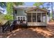 The backyard features a deck with outdoor furniture and a screened porch, ideal for relaxing and entertaining at 405 Widdington Ln, Cary, NC 27519