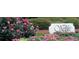 Wellesley community sign amidst colorful landscaping and lush greenery at 405 Widdington Ln, Cary, NC 27519