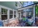 Cozy deck featuring dark metal outdoor furniture, with views of the greenery of the backyard at 405 Widdington Ln, Cary, NC 27519