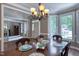Traditional dining room with a wood table, chandelier, and bay window at 405 Widdington Ln, Cary, NC 27519