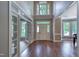 Bright foyer features hardwood floors, high ceilings, and an arched transom window at 405 Widdington Ln, Cary, NC 27519