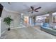 Spacious living room with a ceiling fan, view to the stairs, and a partial view to the kitchen at 405 Widdington Ln, Cary, NC 27519