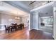 Open-concept living and dining areas with hardwood floors and natural light at 405 Widdington Ln, Cary, NC 27519