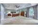 Bright main bedroom with carpet flooring, large windows, and ensuite bathroom at 405 Widdington Ln, Cary, NC 27519
